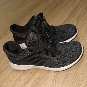 Black Adidas running shoes